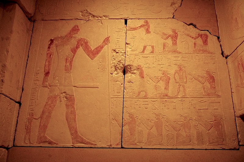 Detail from wall of tomb of Prince Kaninisut showing scribes in seated position. Please click on image to view larger image.